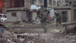 U.S. Marines advancing through the ruined streets of Huế during the Battle of Huế in Full Metal Jacket (1987)